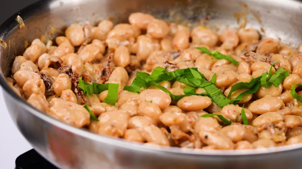 Creamy Tuscan Marry Me Butter Beans in a pan
