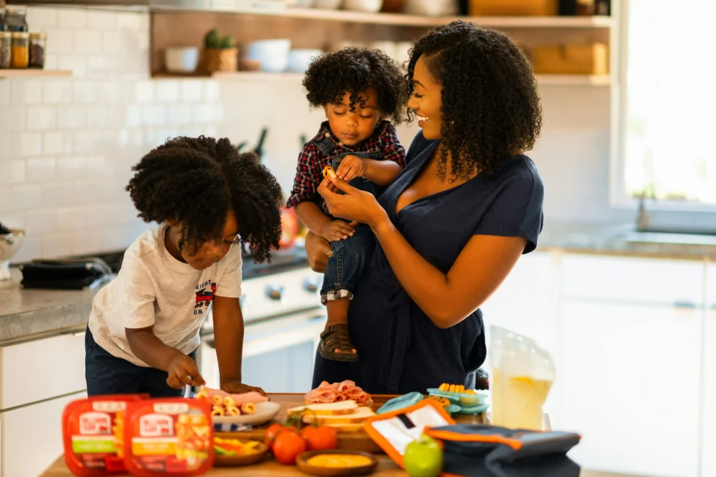 a mom meal prepping with her kids
