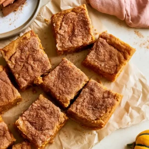Brown Butter Pumpkin Snickerdoodle Bars, served on parchment paper